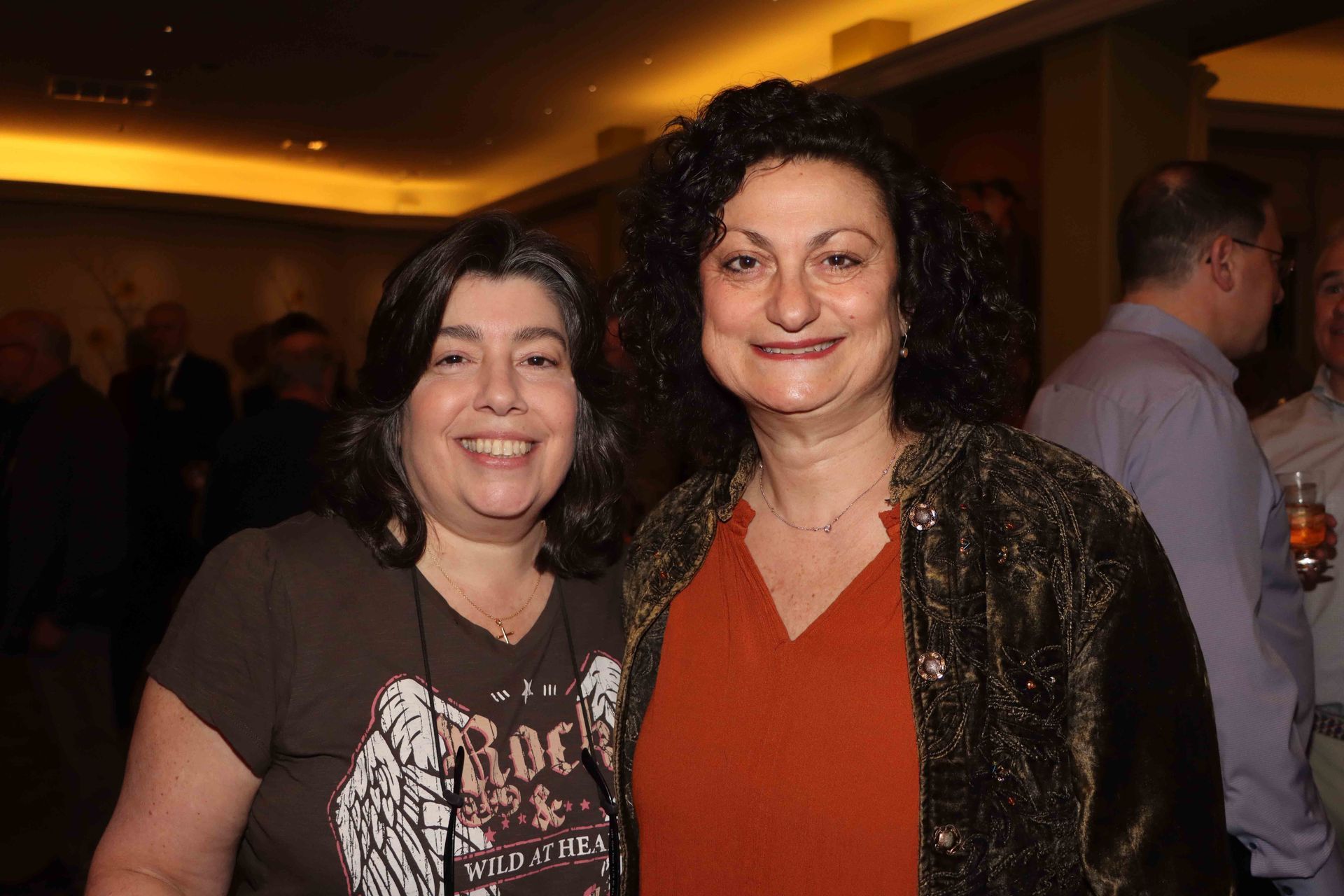 Two Women Are Posing For A Picture And One Of Them Is Wearing A Shirt That Says Rock | Staten Island, NY | RCBA