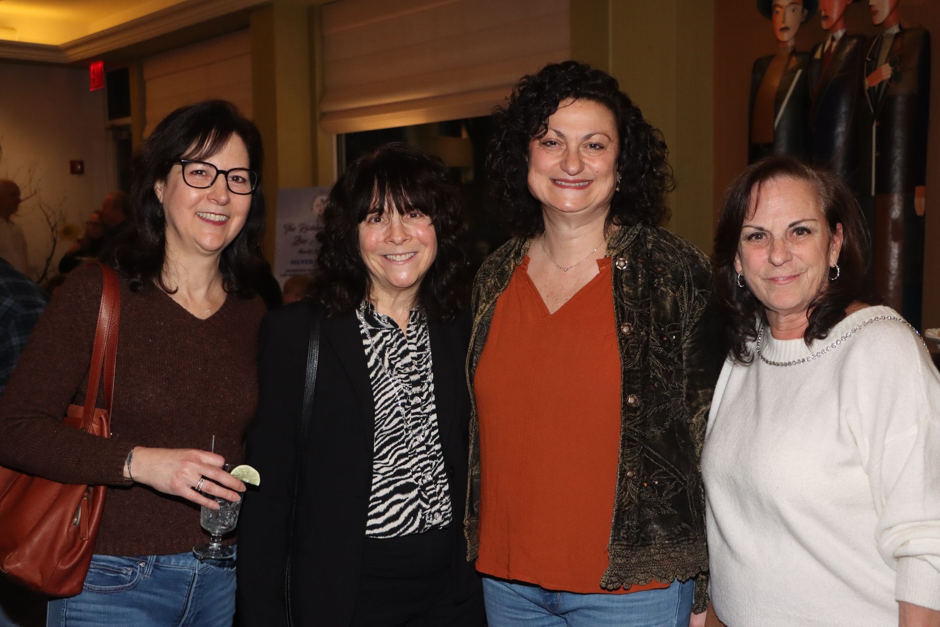 Four Women Are Posing for a Picture Together in a Room | Staten Island, NY | RCBA