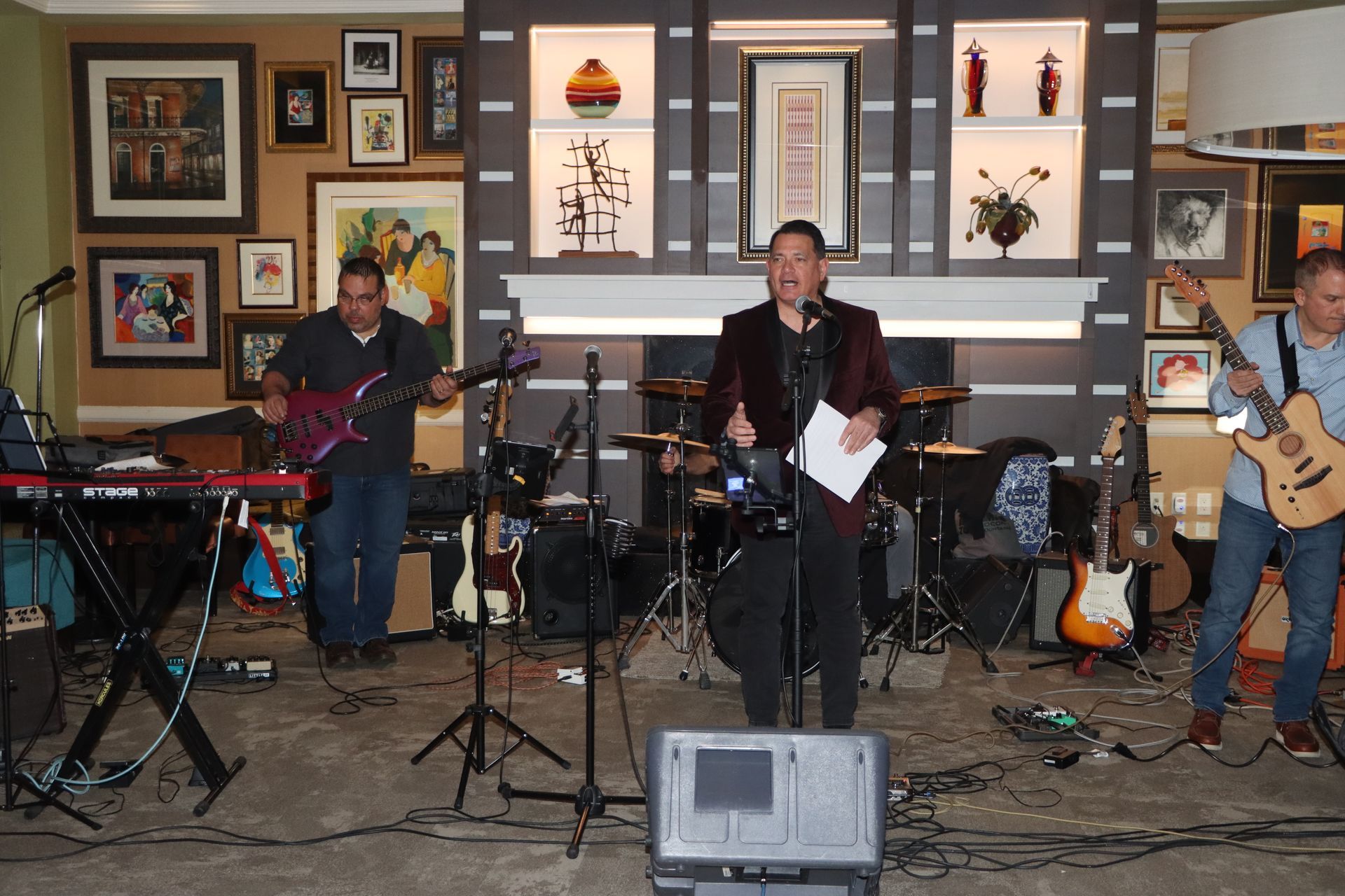 A Group of Men Are Playing Instruments in a Living Room | Staten Island, NY | RCBA