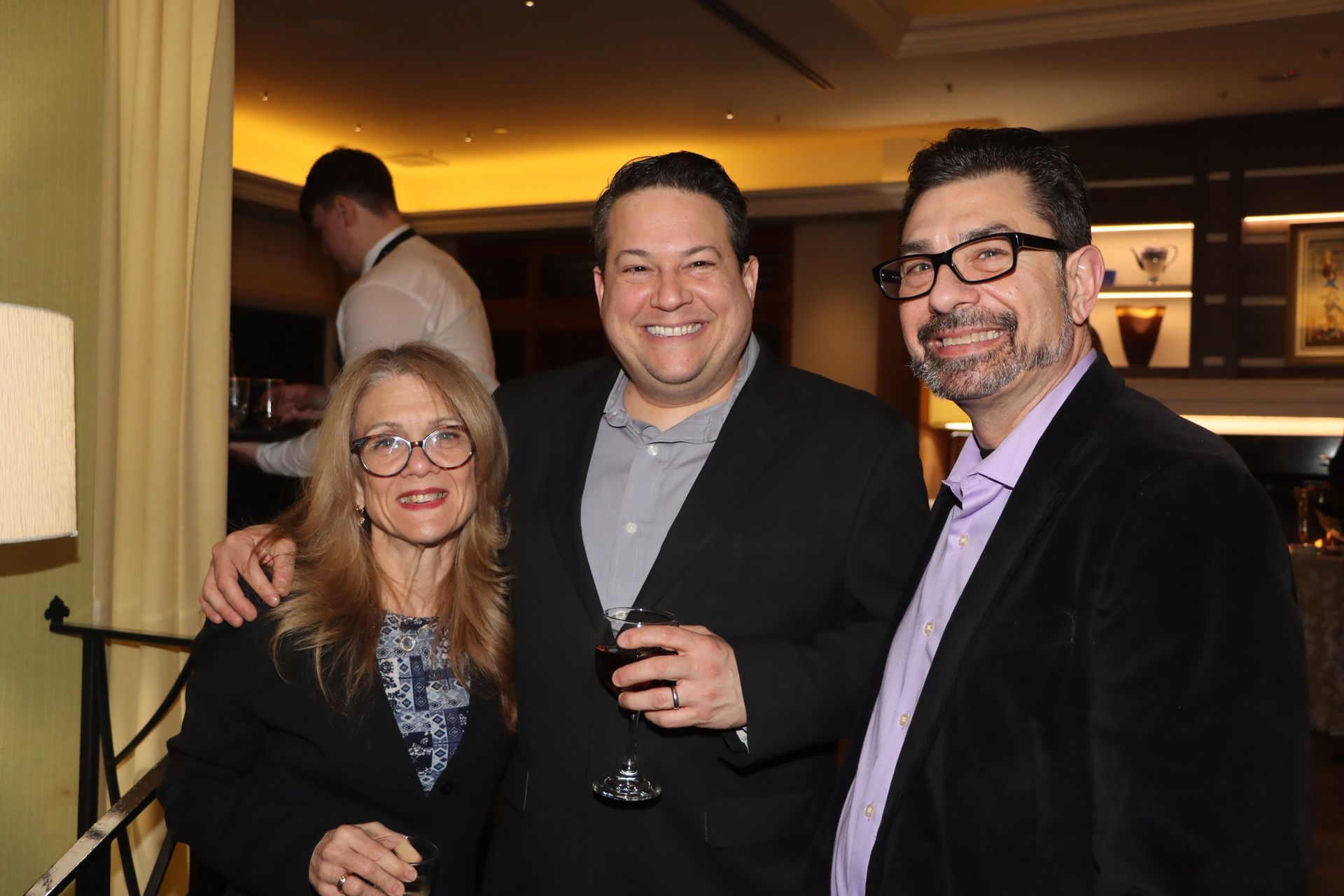 A Group of People Are Posing for a Picture in a Room  | Staten Island, NY | RCBA
