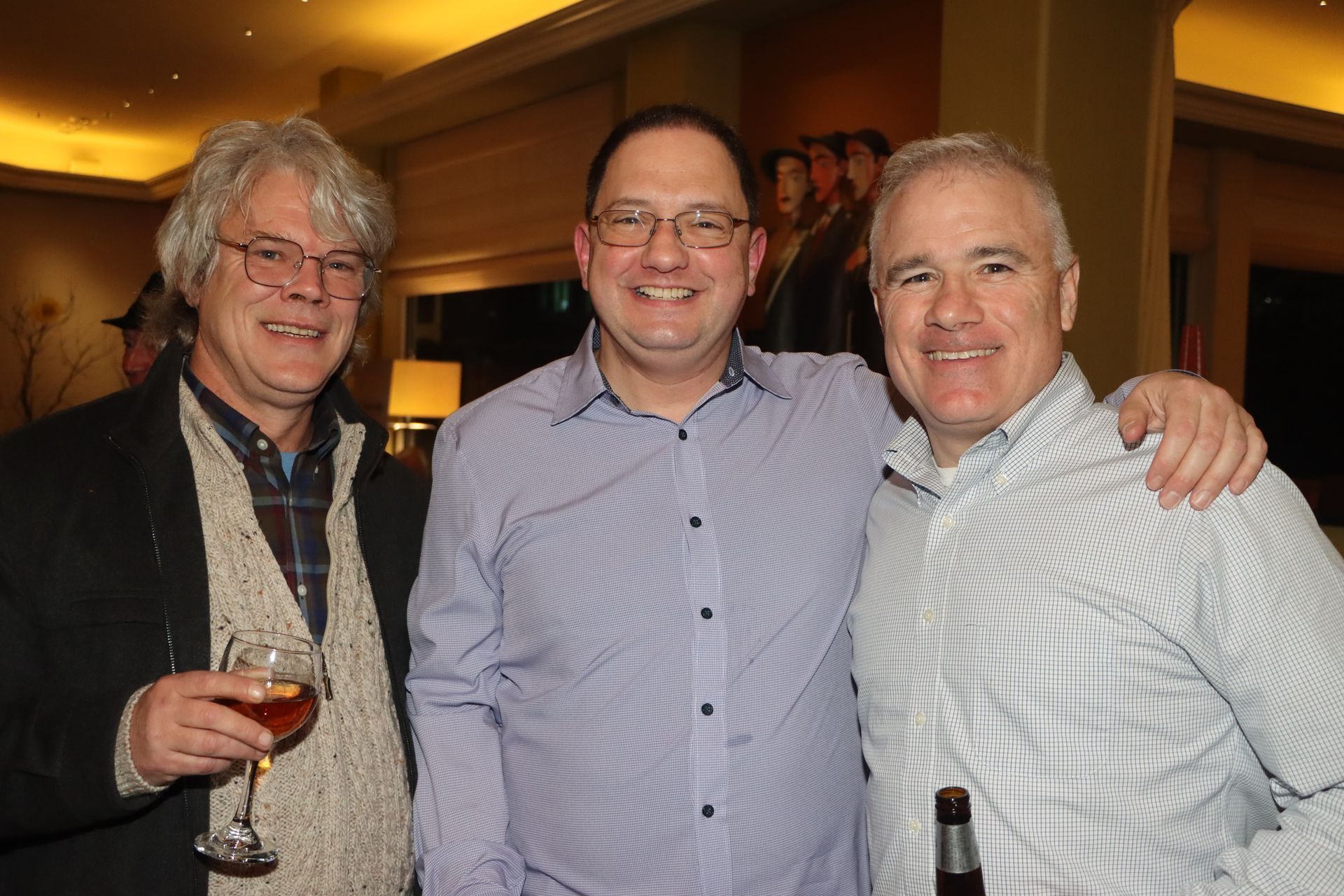 Three Men Are Posing for a Picture and One of Them is Holding a Glass of Wine | Staten Island, NY | RCBA