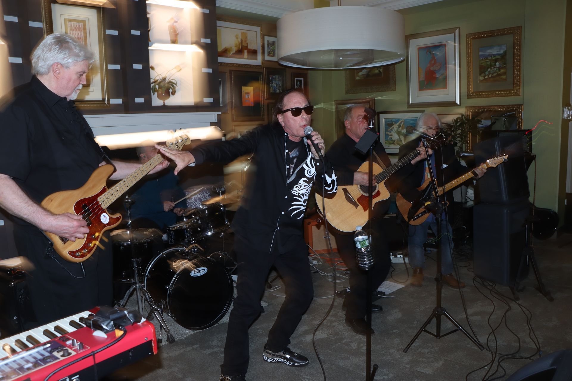 A Group of Men are Playing Guitars and Singing into Microphones — Staten Island, NY — RICHMOND COUNTY BAR ASSOCIATION