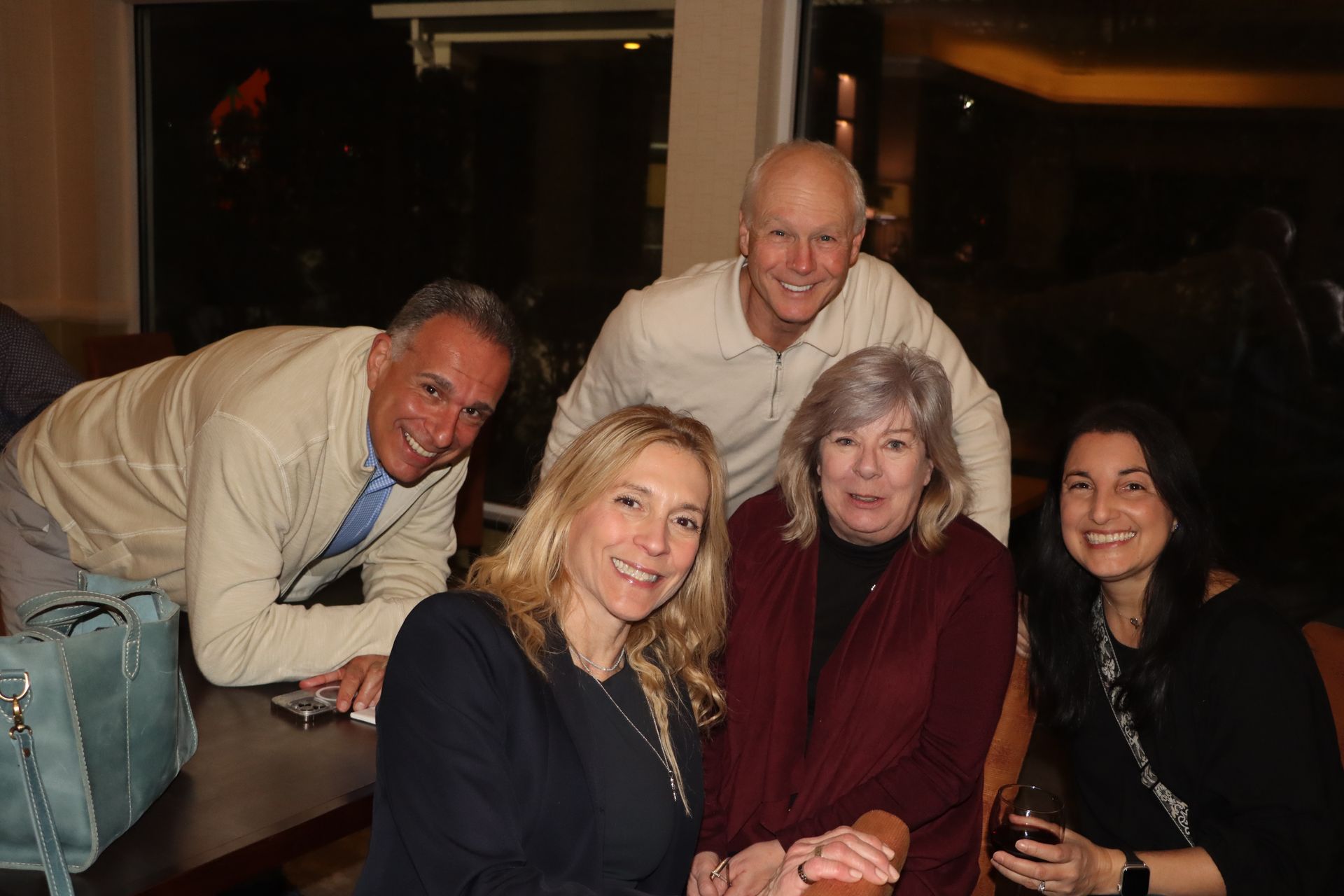 A Group of People are Posing for a Picture While Sitting at a Table — Staten Island, NY — RICHMOND COUNTY BAR ASSOCIATION