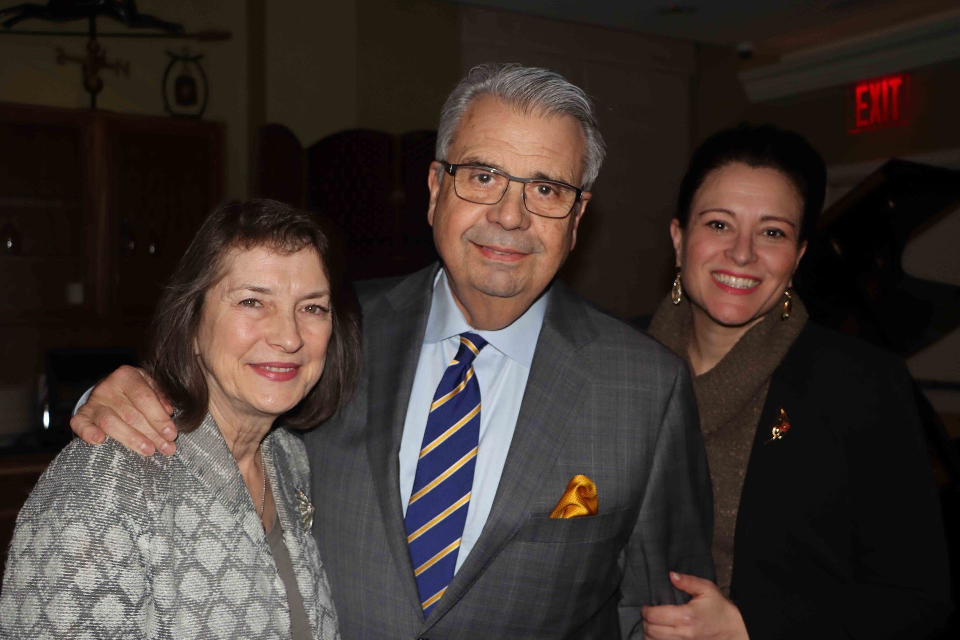 A Man In A Suit And Tie Is Posing For A Picture With Two Women | Staten Island, NY | RCBA