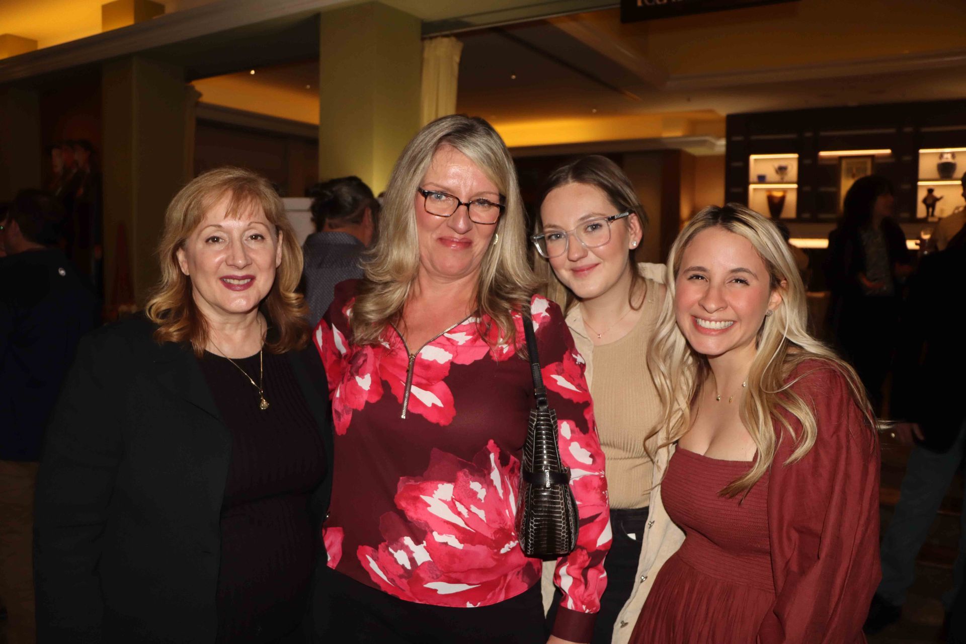 A Group Of Women Are Posing For A Picture Together In A Room | Staten Island, NY | RCBA