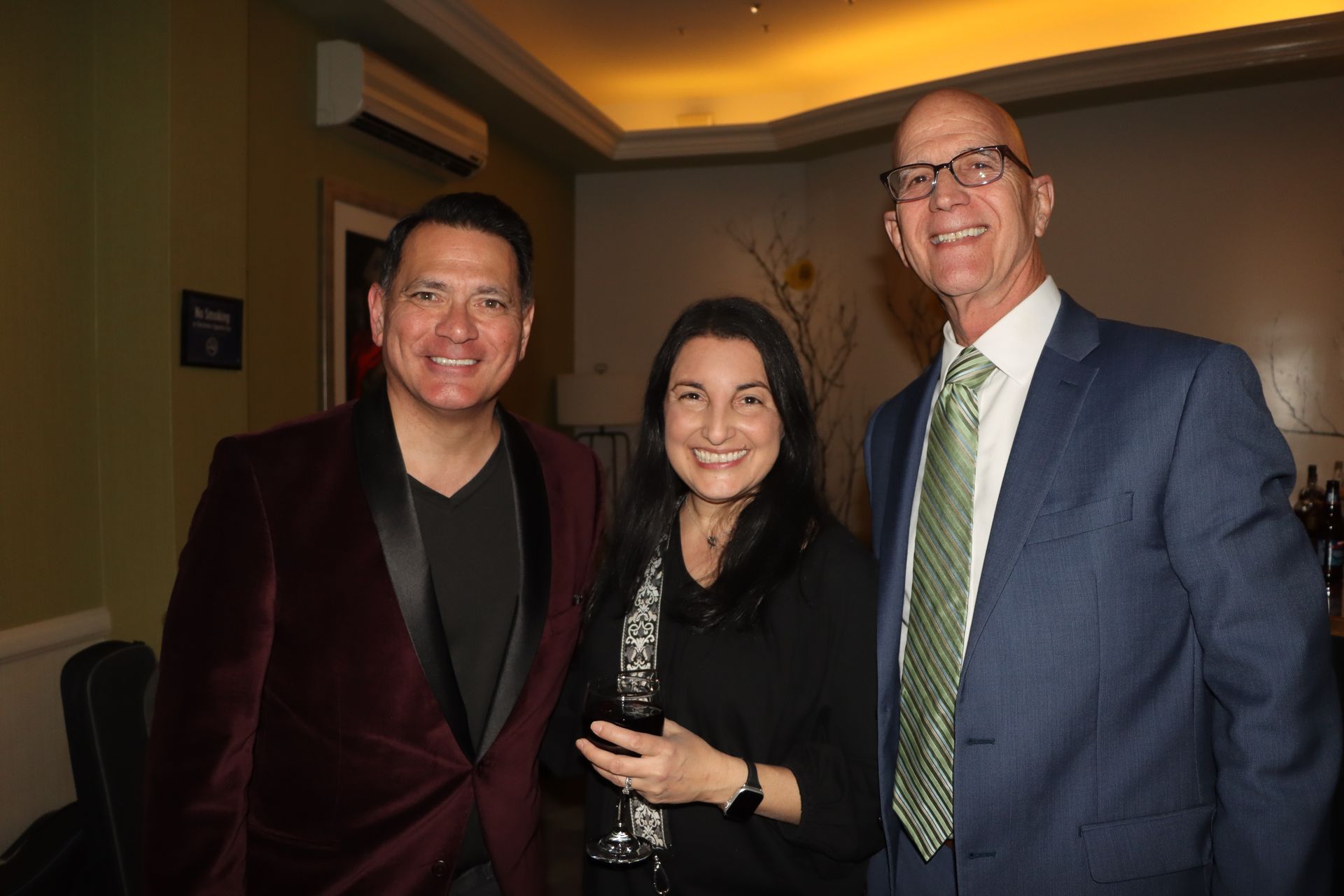 Two Men and a Woman Are Posing for a Picture in a Room  | Staten Island, NY | RCBA