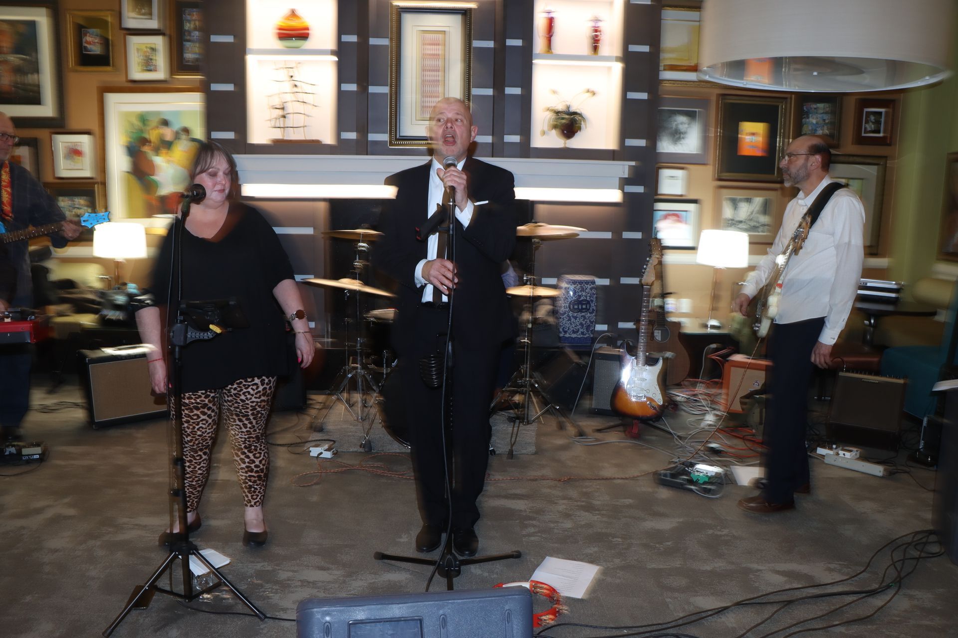 A Man is Singing Into a Microphone While a Woman Stands Behind Him | Staten Island, NY | RCBA