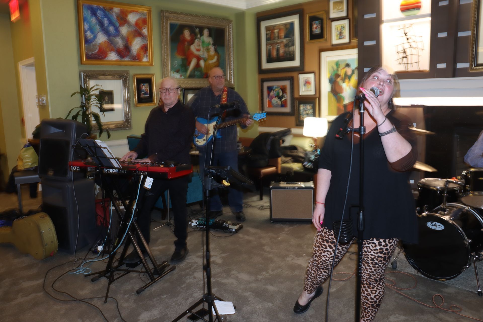 A Woman Singing Into a Microphone in Front of a Band | Staten Island, NY | RCBA