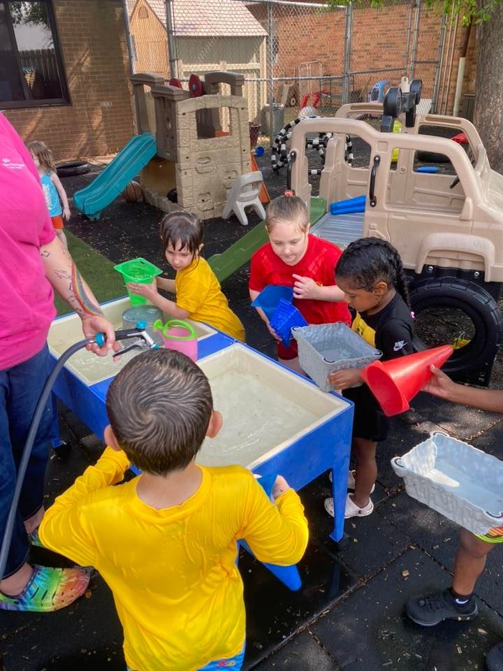 two and children and one teacher - child learning center in Moline IL