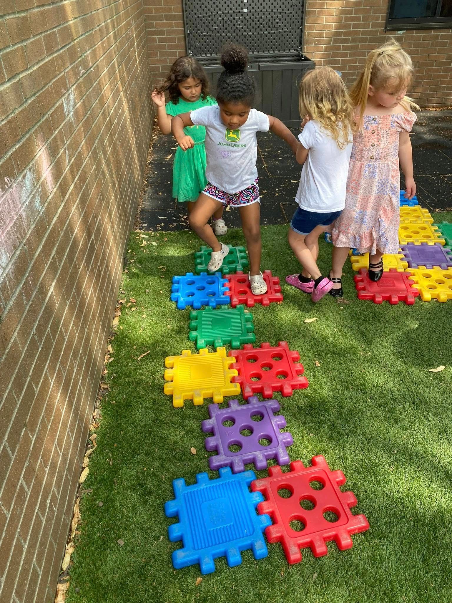 teacher teaching children - child learning center in Moline IL