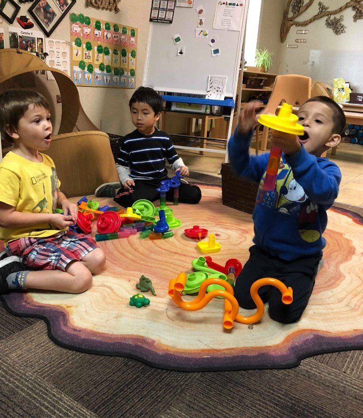 two children having an apple - child learning center in Moline IL