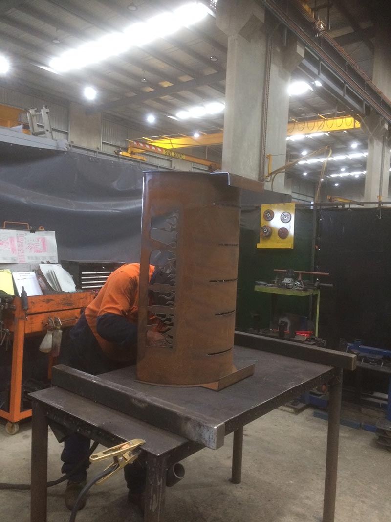 man working on a metal