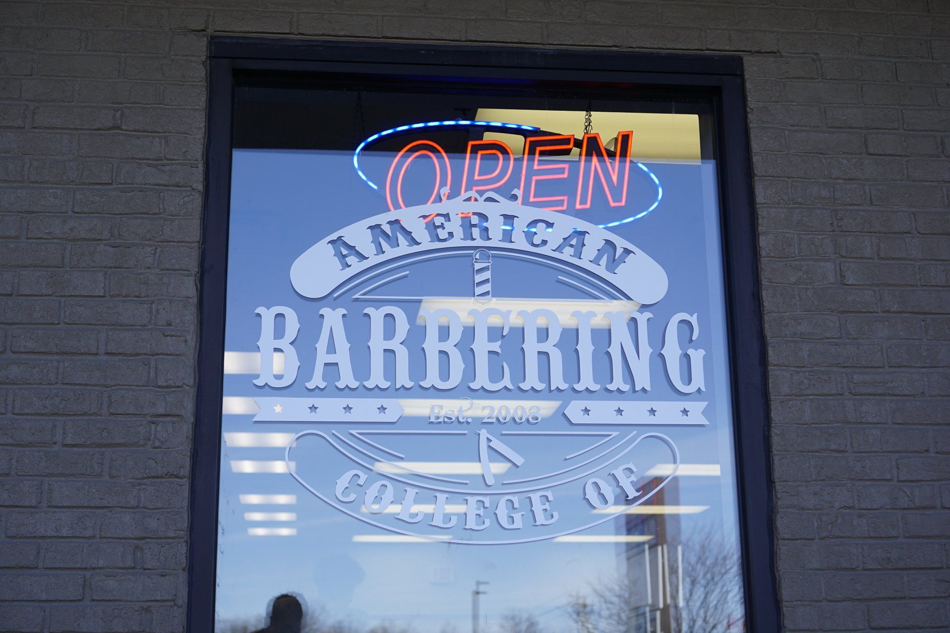 An open sign for an american barber shop