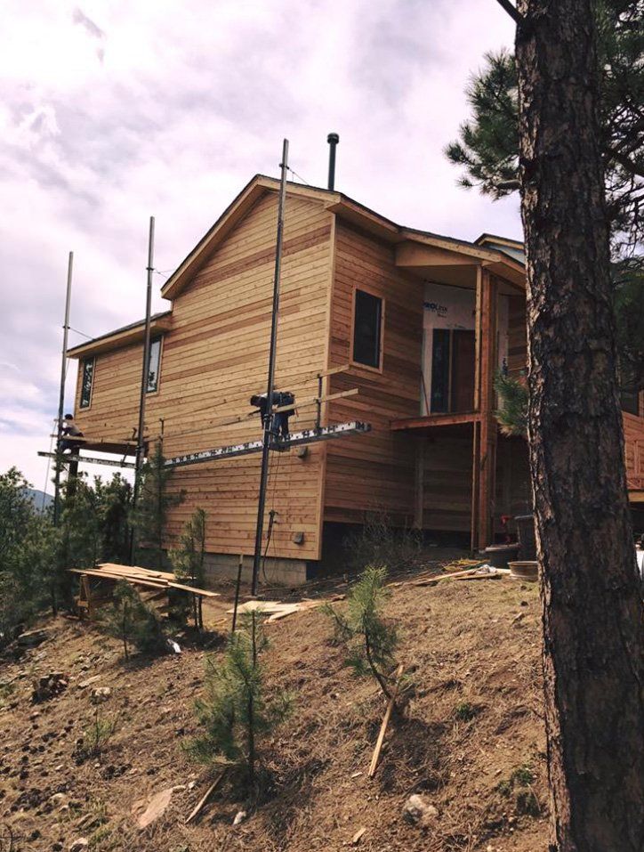 Man on Scaffolding — Lakewood, CO — Watershed Roofing & Restoration