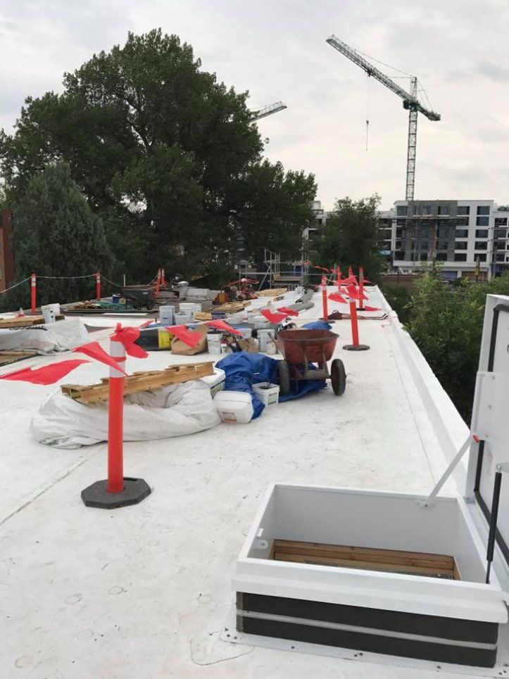 Installing Roof on Commercial Building — Lakewood, CO — Watershed Roofing & Restoration
