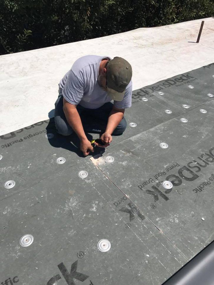 Man Installing Base of Roof — Lakewood, CO — Watershed Roofing & Restoration