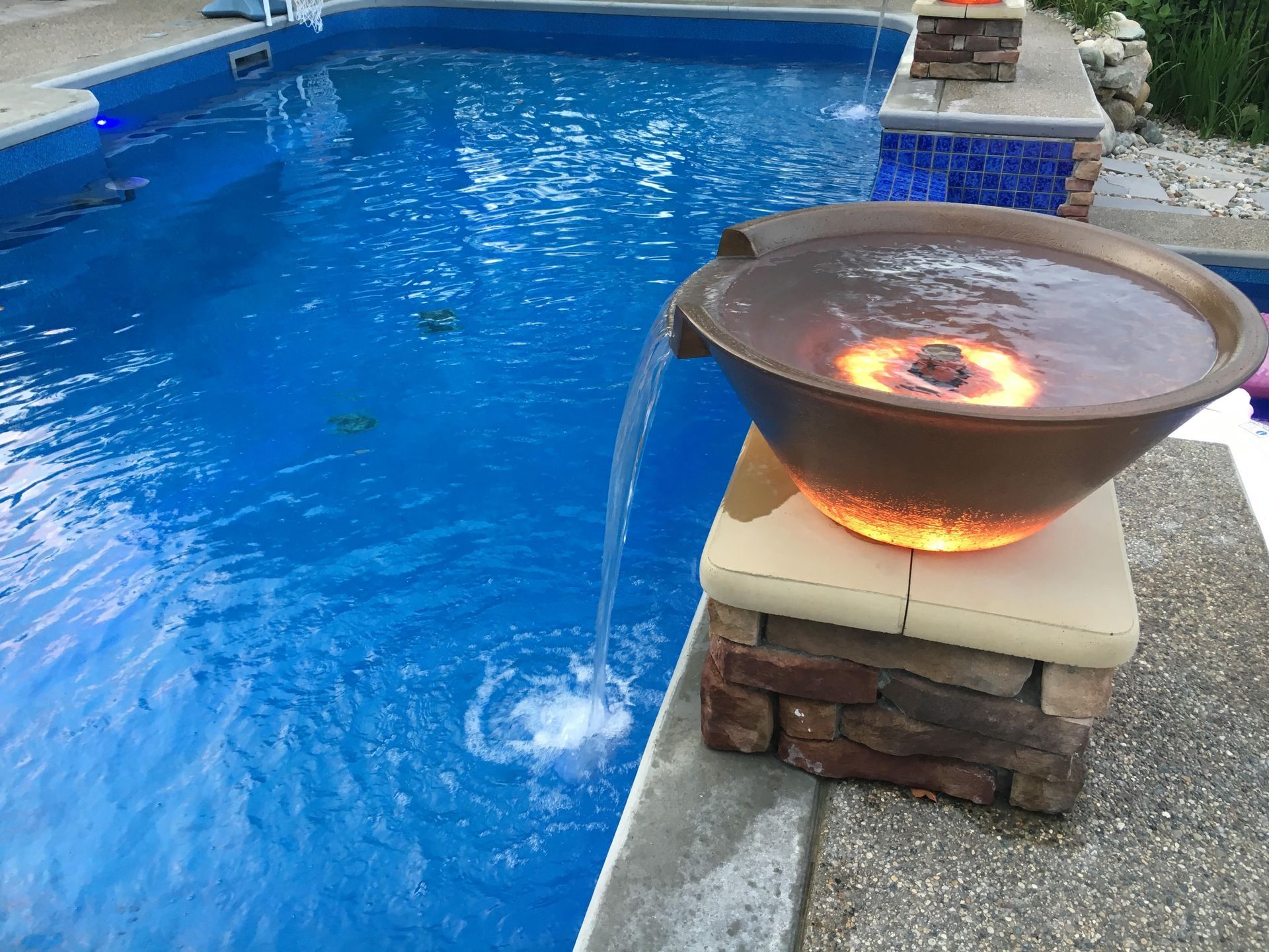 In-ground pool with fire and water feature