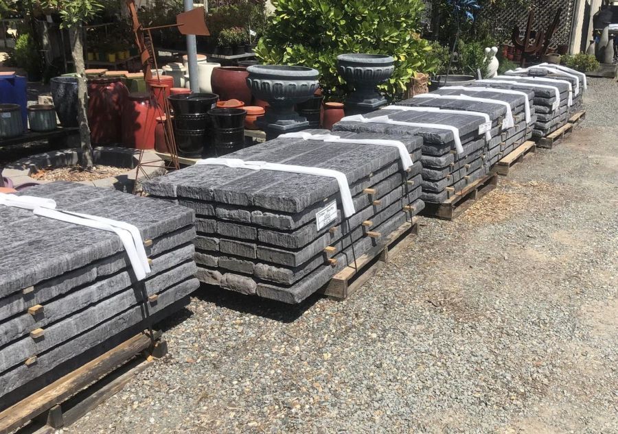 A Table Filled With Lots of Potted Plants and Flowers — Golden City Gympie Brick & Landscape in Gympie, QLD