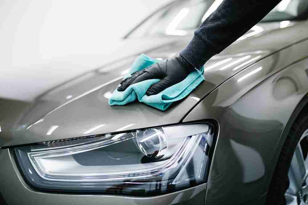Cleaning Car Hood with Microfiber Cloth — Car Wash in Maitland