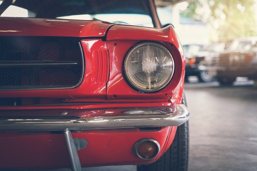 Headlight of a Red Vintage Car — Car Detailing in Port Stephens