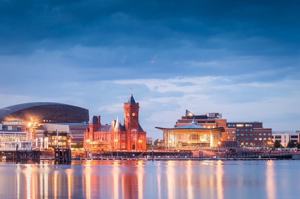 A City Skyline Overlooking a Body of Water at Night — VIP Car Care Newcastle in Cardiff, NSW