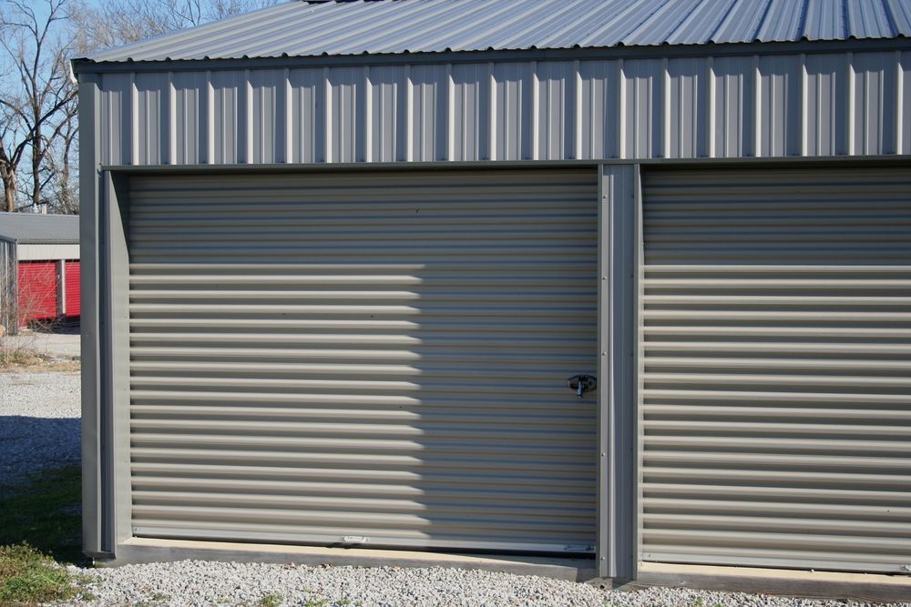 Two Beige Roll-up Storage Unit Doors on a Grey Metal Building — King Street Storage Emerald in Emerald, QLD