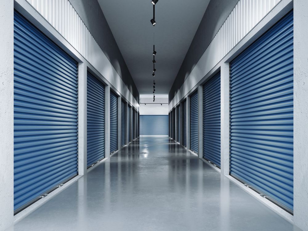 A Long Rows of Blue, Closed Roll-up Metal Storage Unit Doors — King Street Storage Emerald in Emerald, QLD
