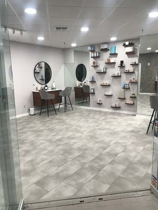 A large room with a lot of shelves and mirrors