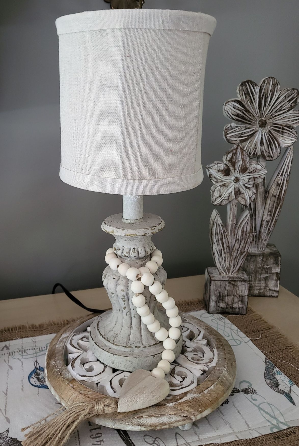 interior decorating. a lamp with a white shade is sitting on a table .
