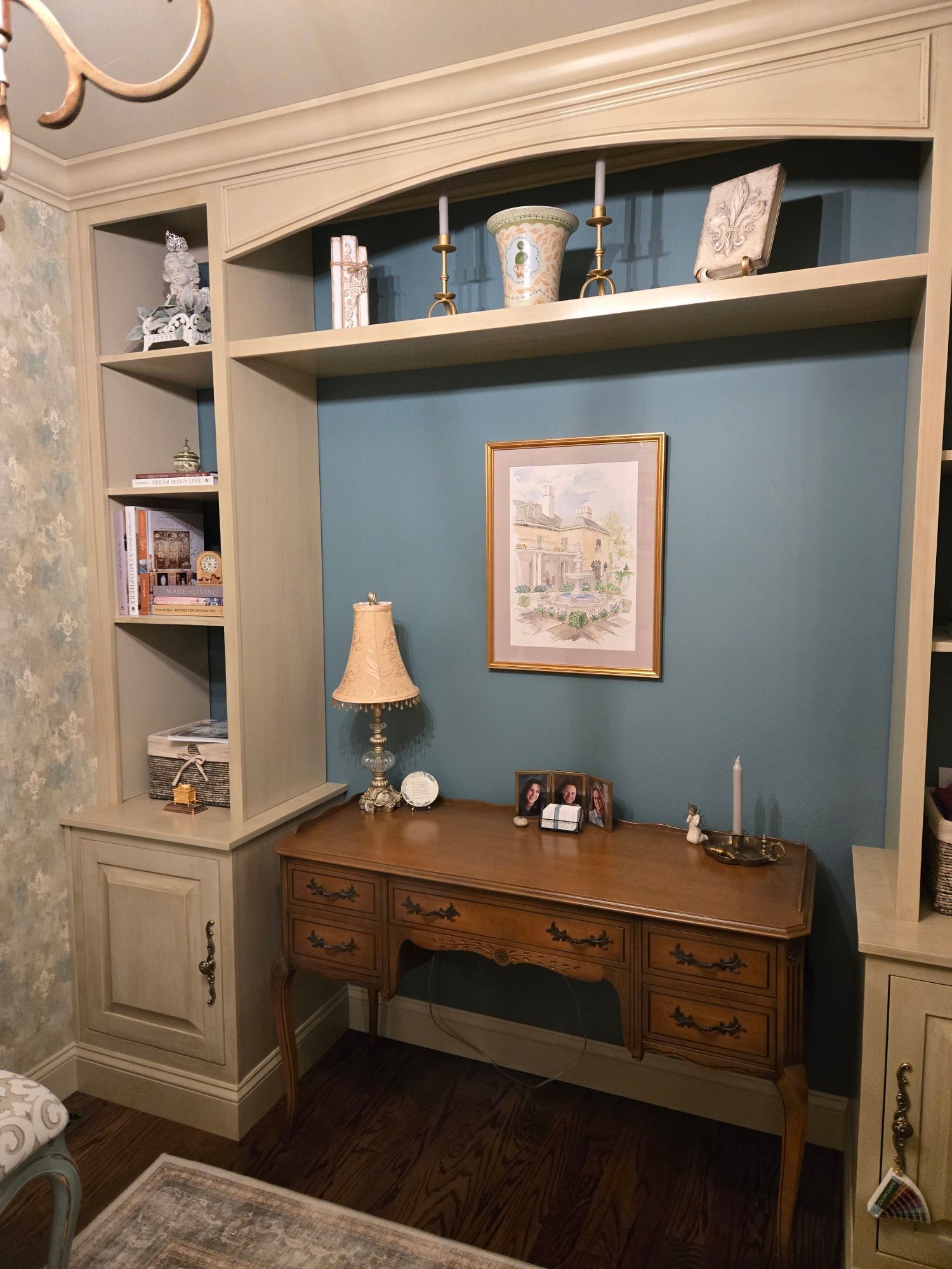 interior design featuring closet converted into a space for shelves and a french antique desk