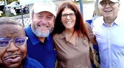 A group of people are posing for a picture together.