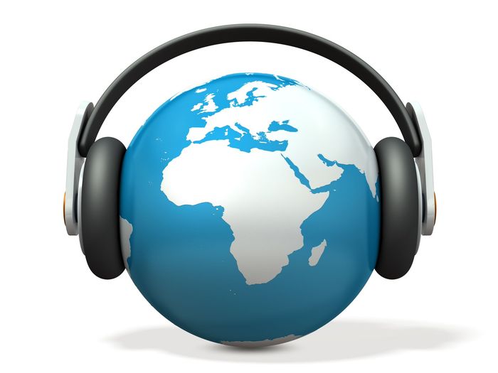 A blue and white globe with headphones on it