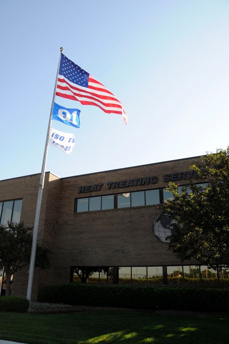 Heat Treat Services Plant 1 building with American Flag.