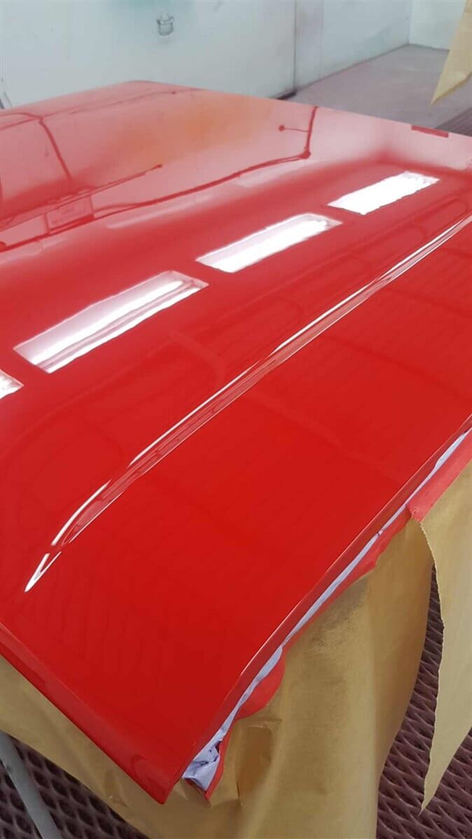 red car part painted — Smash Repairs in Coffs Harbour, NSW