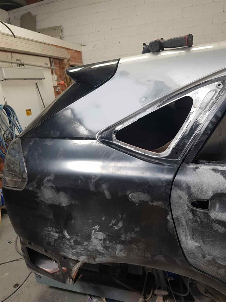 Damaged black car — Smash Repairs in Coffs Harbour, NSW