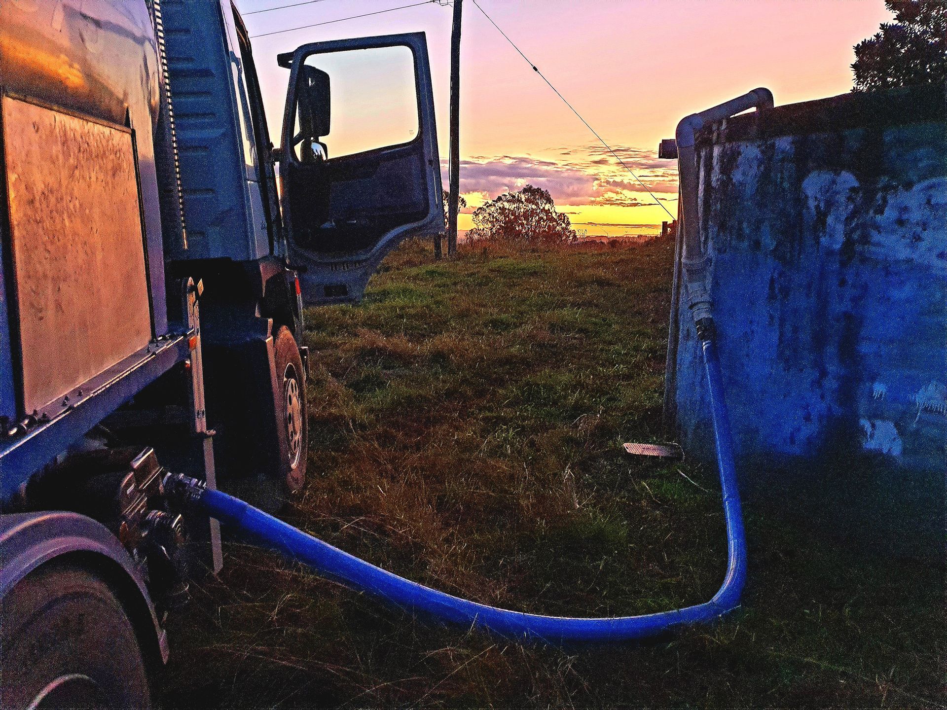 A Waterfall is Coming Down the Side of a Swimming Pool — Water 4 You In Clovass, NSW