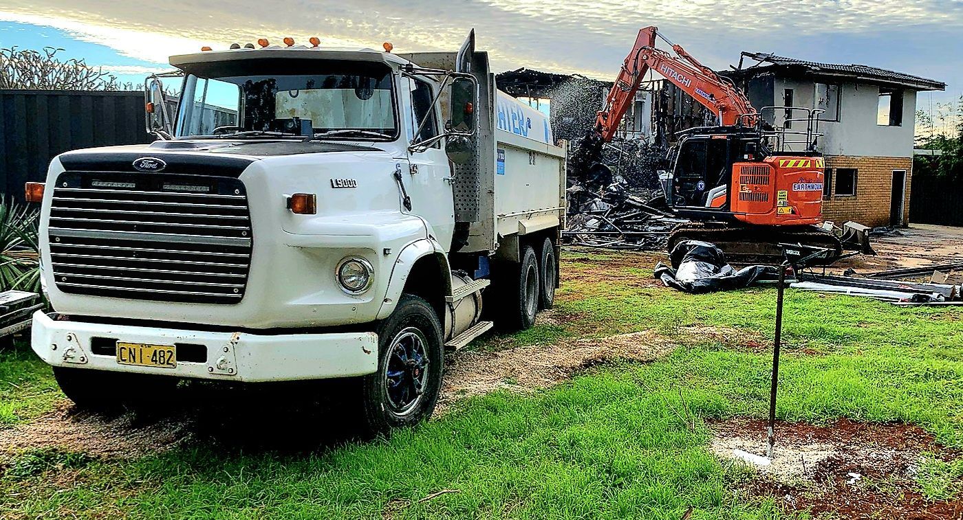 A Large Water Truck Putting Water On The A House Getting Demoed — Water 4 You In Clovass, NSW