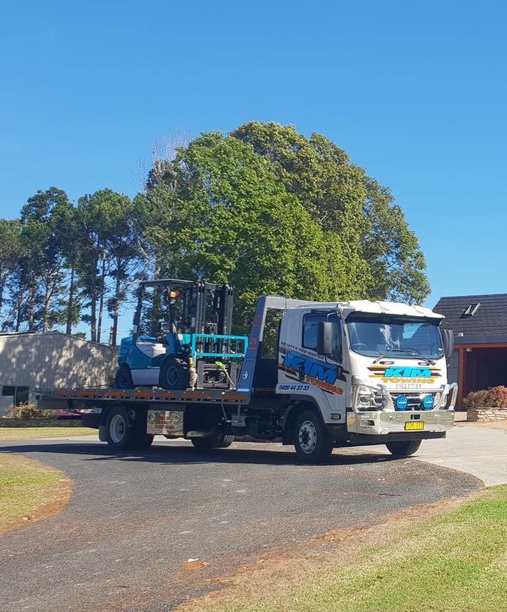 A Tow Truck With A Forklift On The Back — KTM Towing In Kempsey, NSW