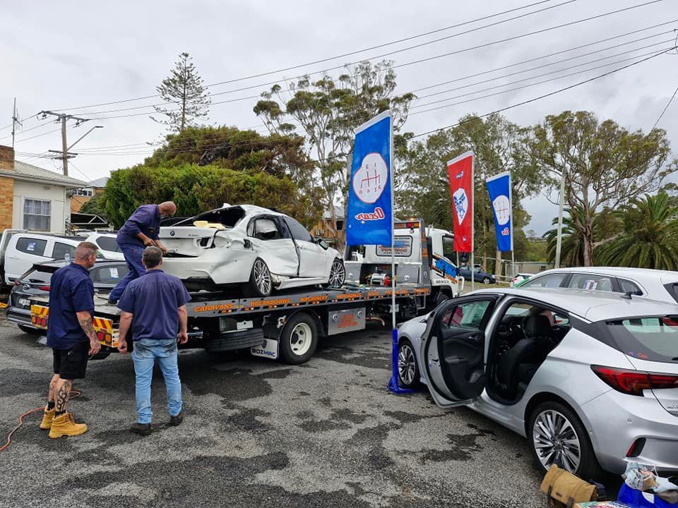 A Smashed Car On A Tow Truck — KTM Towing In Kempsey, NSW