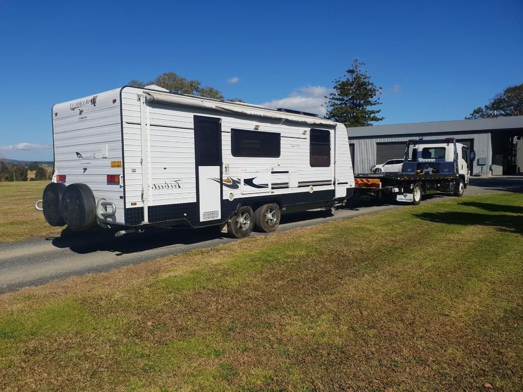 Caravan Being Towed By A Tilt Tray Truck — KTM Towing In Kempsey, NSW