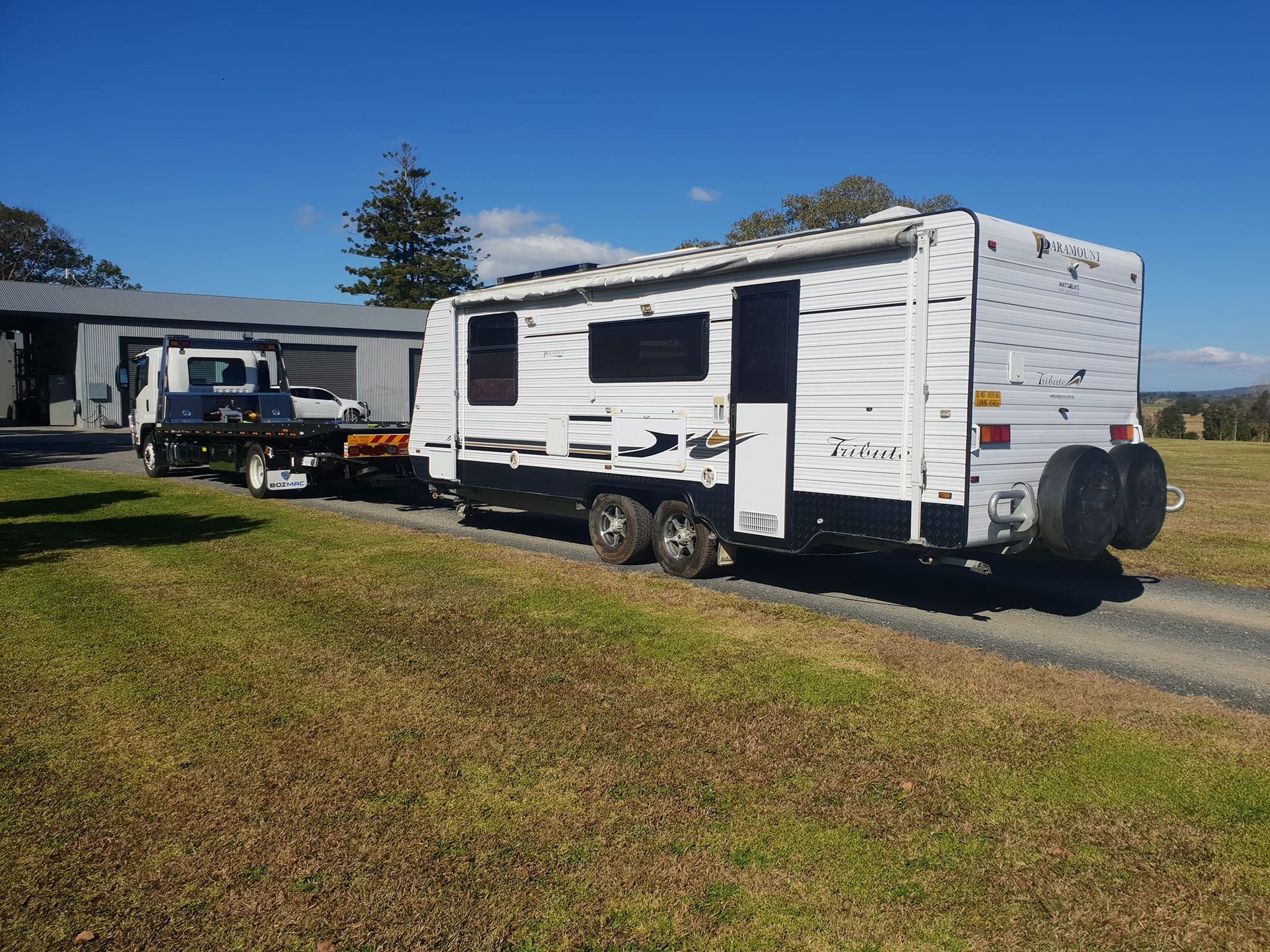 A White Trailer Is Being Towed By A Tow Truck — KTM Towing In Crescent Head, NSW