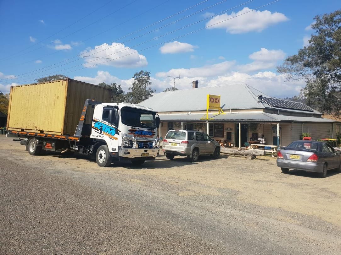 Container Being Towed On A Tow Tilt Tray Truck — KTM Towing In Port Macquarie, NSW