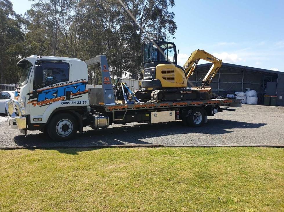 Yellow Bobcat Being Towed — KTM Towing In Kempsey, NSW