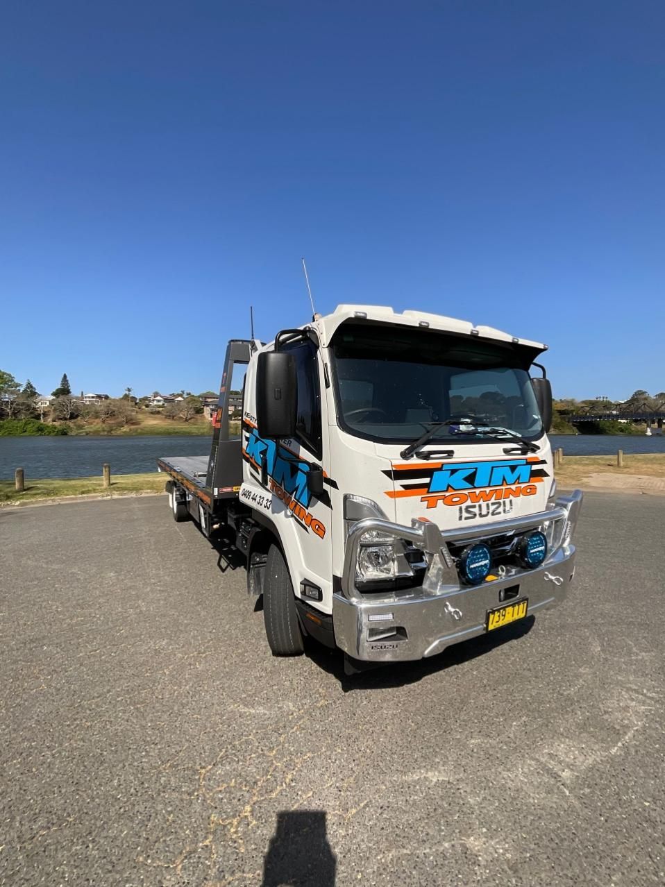 A Tow Truck Is Parked On The Side Of The Road — KTM Towing In Kempsey, NSW