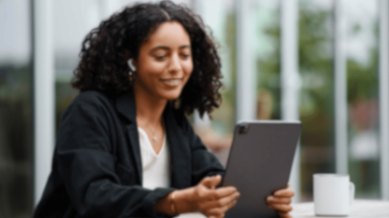 woman reading a school marketing blog on her tablet