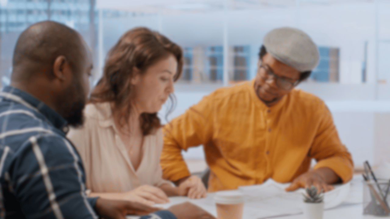 School marketing, communications, and admissions at a table