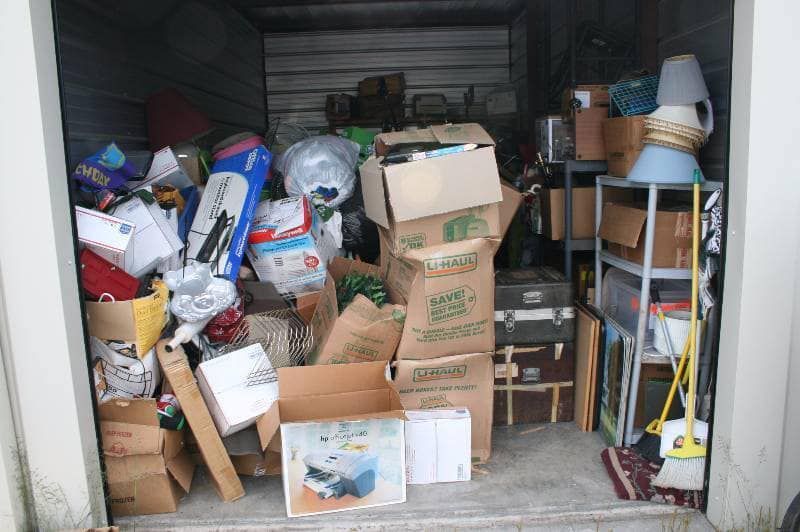A garage filled with lots of boxes and other items