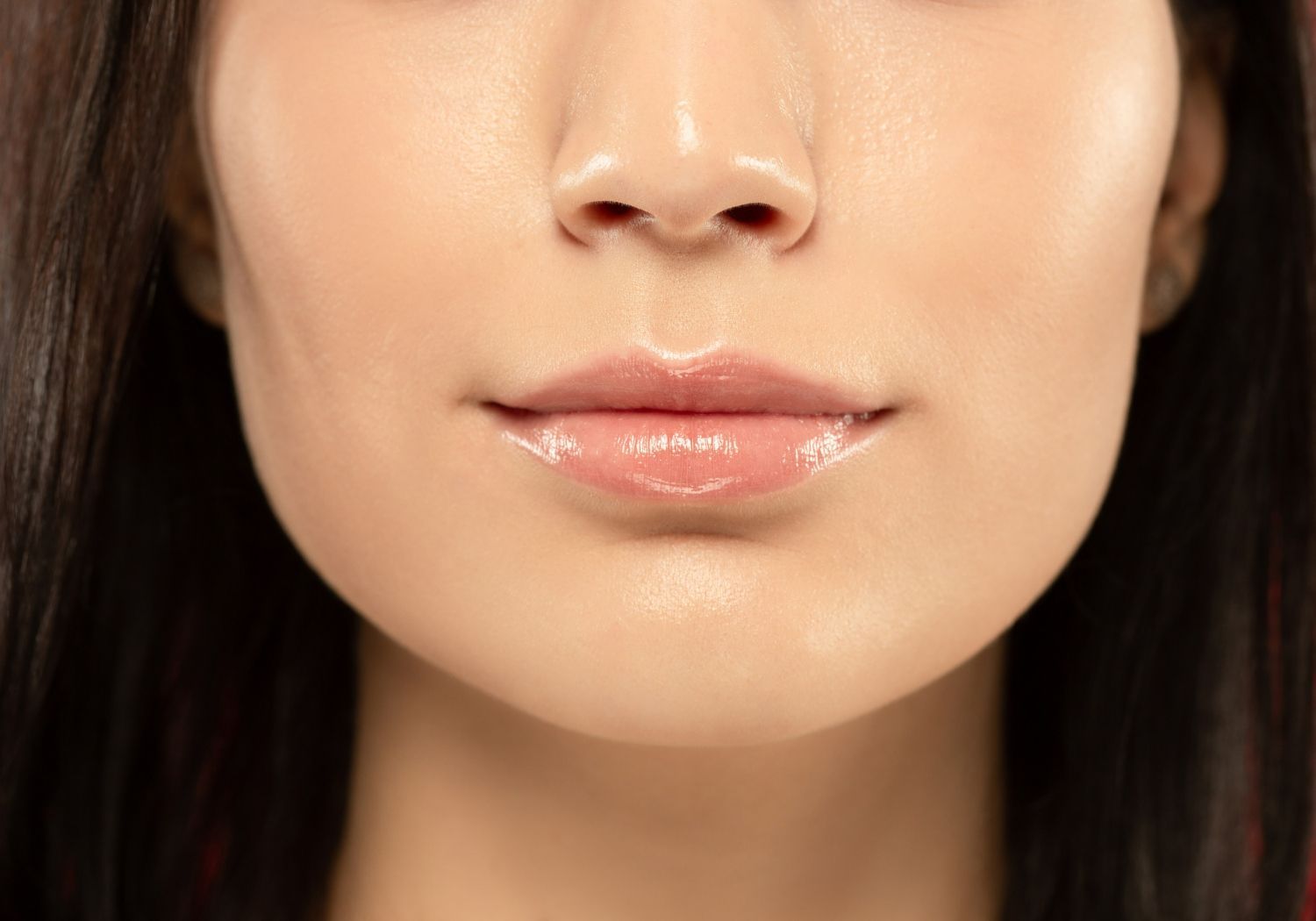 A close up of a woman 's lips and nose.