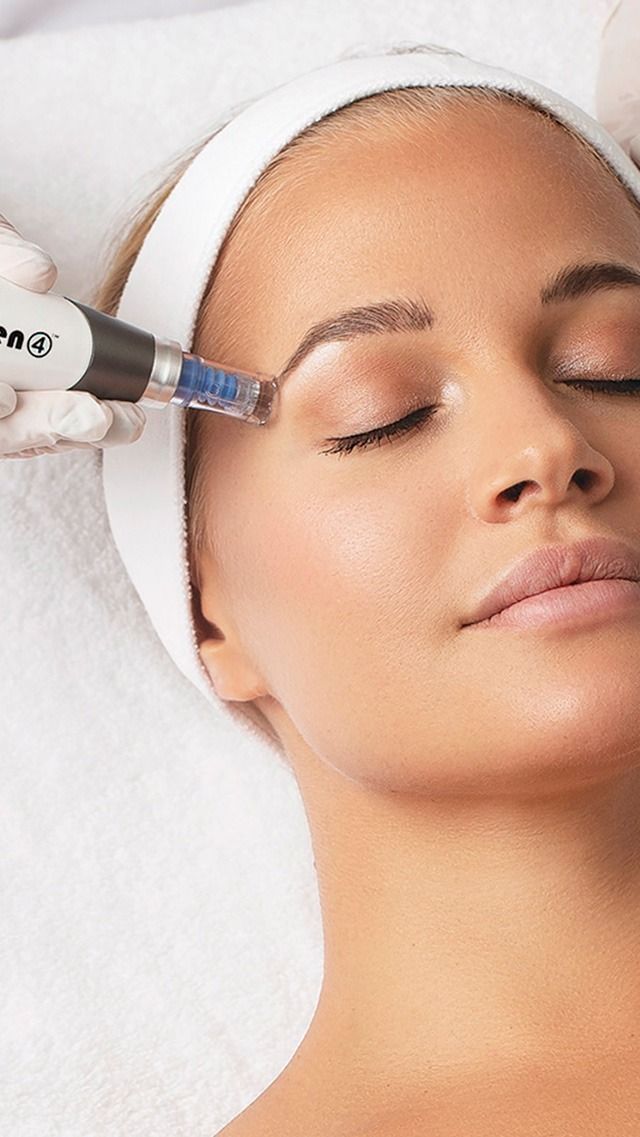 A woman is getting a facial treatment at a beauty salon.
