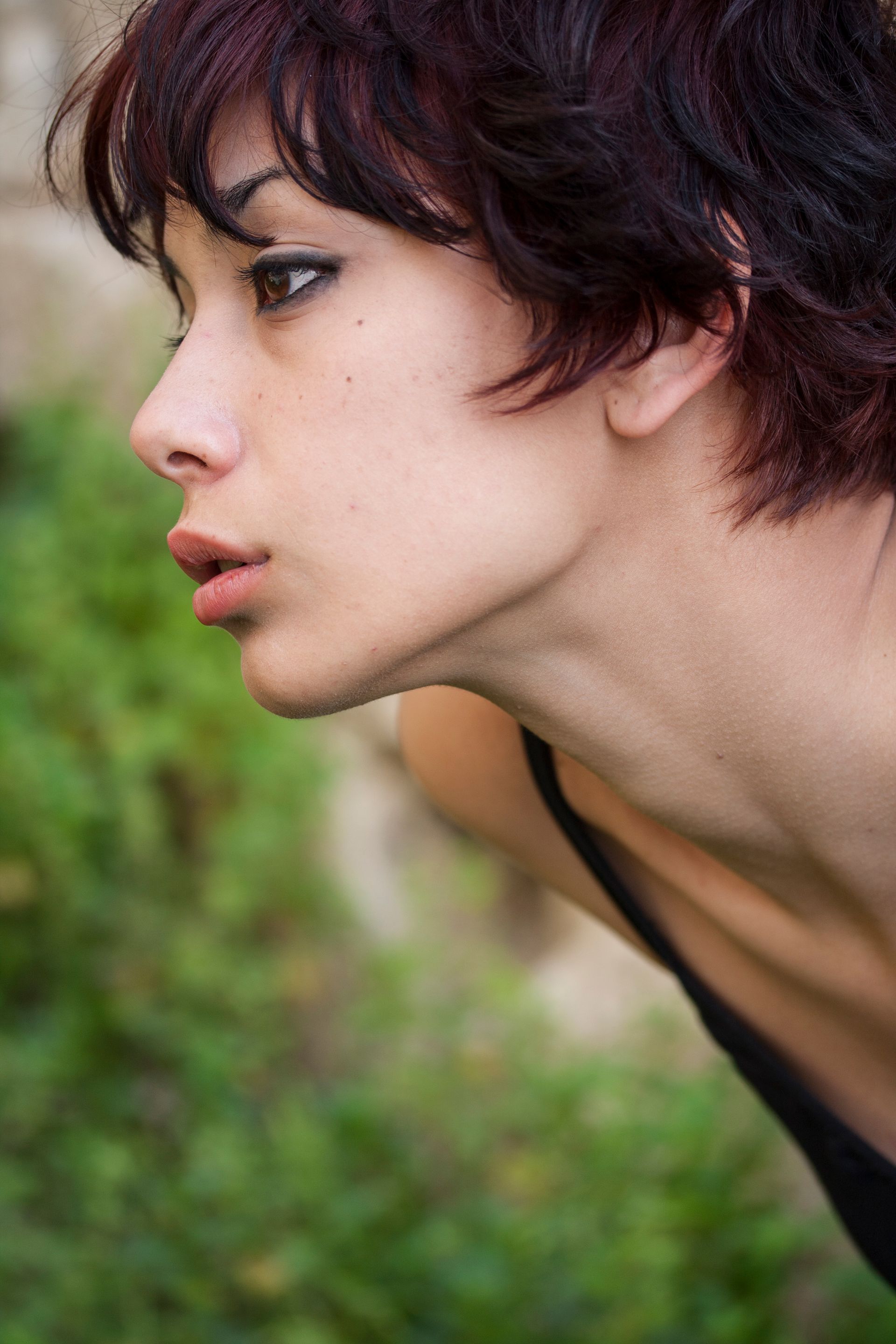 A close up of a woman 's face with her mouth open.